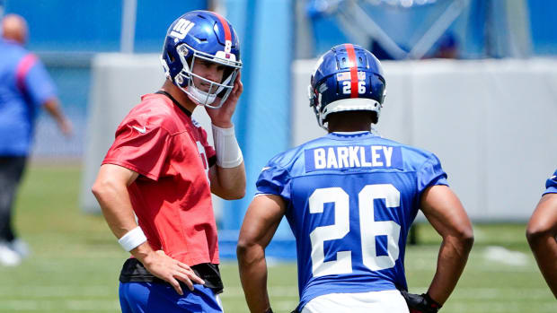 New York Giants quarterback Daniel Jones (8) and running back Saquon Barkley (26) on the field for mandatory minicamp at the Quest Diagnostics Training Center on Tuesday, June 7, 2022, in East Rutherford.